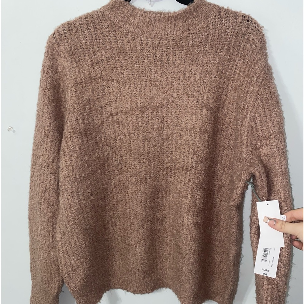 Never worn sweater. New with tags